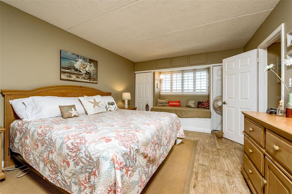 4799 South Atlantic Avenue, Unit 3030 Ponce Inlet, FL 32127 - Photo 12 of 26 a spacious bedroom with a bed and a large window