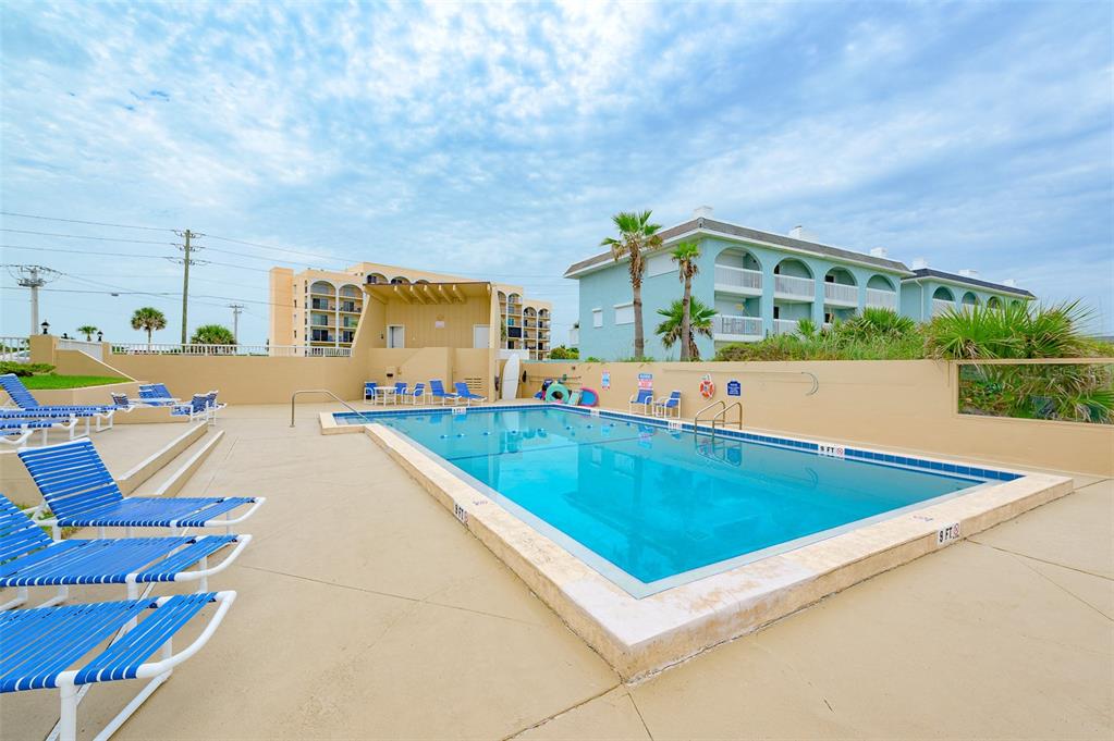 4799 South Atlantic Avenue, Unit 3030 Ponce Inlet, FL 32127 - Photo 21 of 26 a view of a swimming pool with an outdoor seating