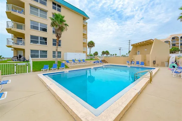 a view of outdoor space with pool and seating area