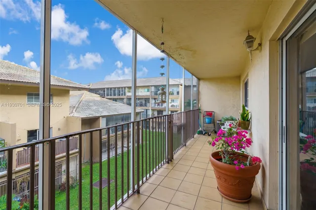 a view of a porch and potted plant