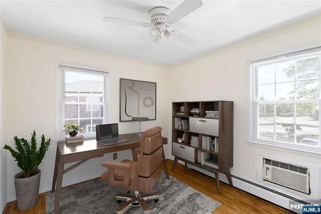 a work room with furniture and a window