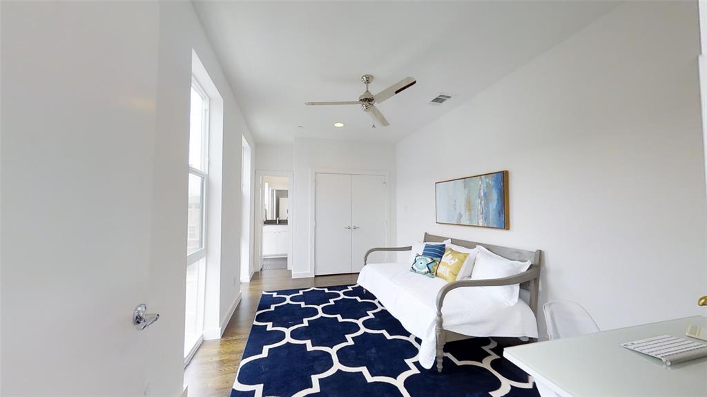 4905 Live Oak Street, Unit D Dallas, TX 75206 - Photo 12 of 19 a bedroom with furniture and a rug