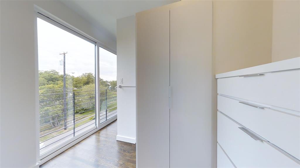 4905 Live Oak Street, Unit D Dallas, TX 75206 - Photo 19 of 19 a view of empty room with wooden floor and fan