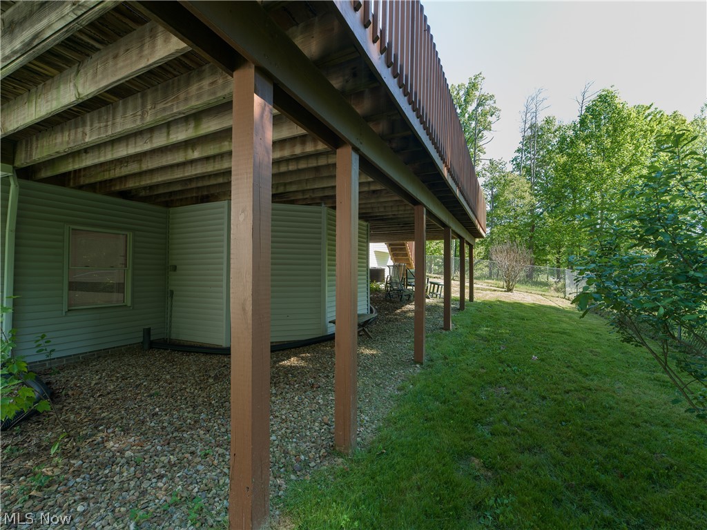 8745 Broadview Road Broadview Heights, OH 44147 - Photo 43 of 49 Elevated deck structure supported by wooden posts, featuring a slatted railing and exposed wood joists