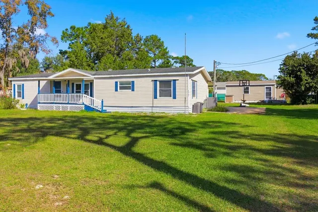 a bedroom with a bed and a view of bathroom
