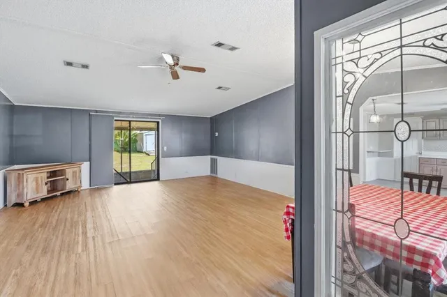 a bathroom with a tub a sink and mirror