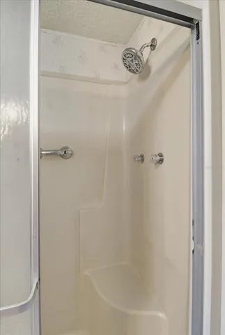 an aerial view of residential house with outdoor space and trees all around