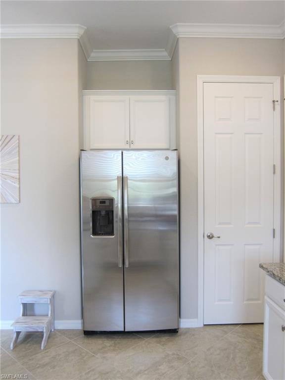 1170 Genovesa Court, Unit 12 Naples, FL 34113 - Photo 13 of 18 a bathroom with a glass shower door