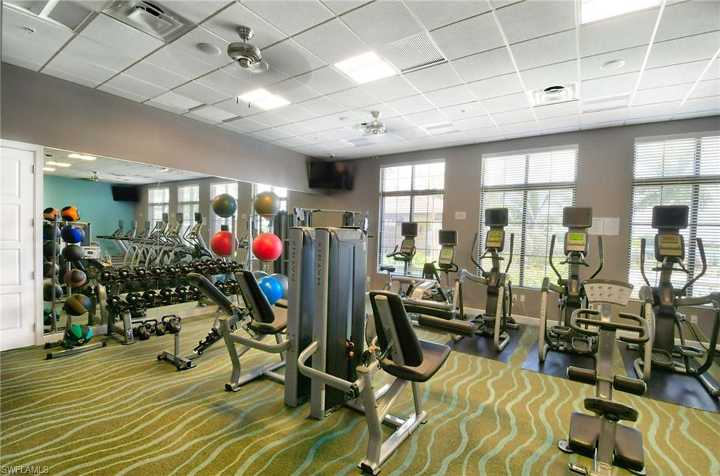 1170 Genovesa Court, Unit 12 Naples, FL 34113 - Photo 16 of 18 a view of a room with gym equipment