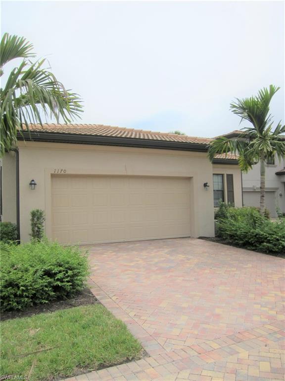 1170 Genovesa Court, Unit 12 Naples, FL 34113 - Photo 2 of 18 a house with a outdoor space