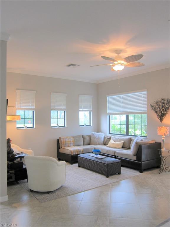 1170 Genovesa Court, Unit 12 Naples, FL 34113 - Photo 3 of 18 a living room with furniture and a large window
