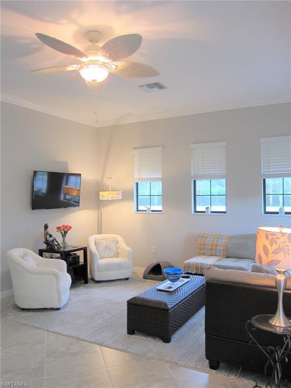 1170 Genovesa Court, Unit 12 Naples, FL 34113 - Photo 4 of 18 a bedroom with furniture and a couch