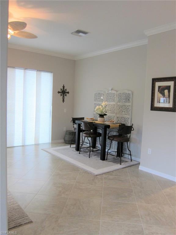 1170 Genovesa Court, Unit 12 Naples, FL 34113 - Photo 5 of 18 a view of a room with furniture and wooden floor