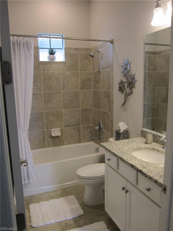 1170 Genovesa Court, Unit 12 Naples, FL 34113 - Photo 10 of 18 a bathroom with a sink a toilet and shower