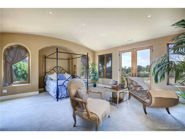 3520 Fortuna Ranch Road Encinitas, CA 92024 - Photo 6 of 11 Barrel Vault Ceiling With Micro Low Voltage Recessed Lighting, Opposing Sets of Single Light French Doors, His & Her Bedside Lighted Niches With Electronic Ports, His And Her Reading Lights, Fireplace, Built In Surround Sound System, Arched Windows.