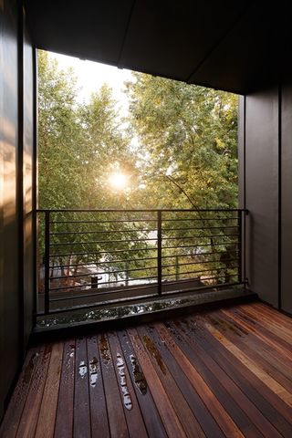 a view of a balcony with wooden floor