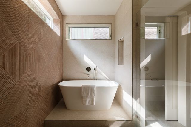 a white toilet sitting next to a sink