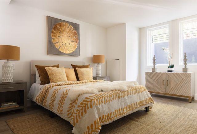 a bedroom with bed and a window