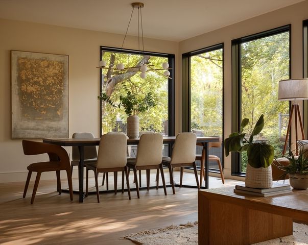 a view of a dining room with furniture window and wooden floor