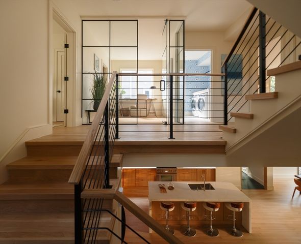 a view of entryway and hall with wooden floor