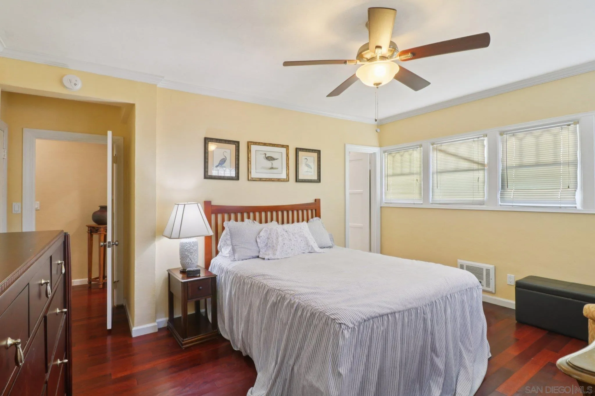 3509-11 32nd Street San Diego, CA 92104 - Photo 16 of 51 a bedroom with a bed and a chandelier