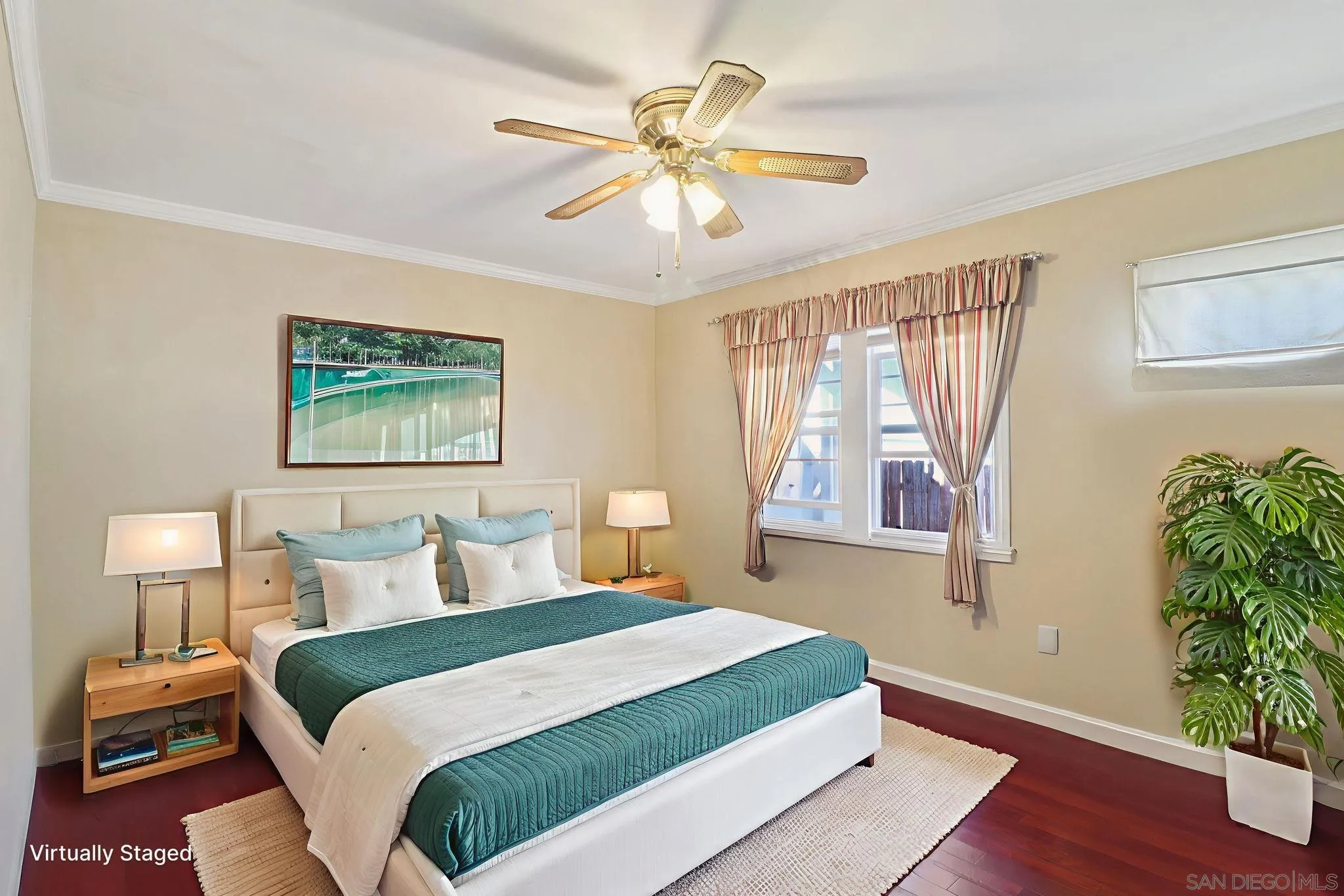 3509-11 32nd Street San Diego, CA 92104 - Photo 19 of 51 a bedroom with a large bed and a window