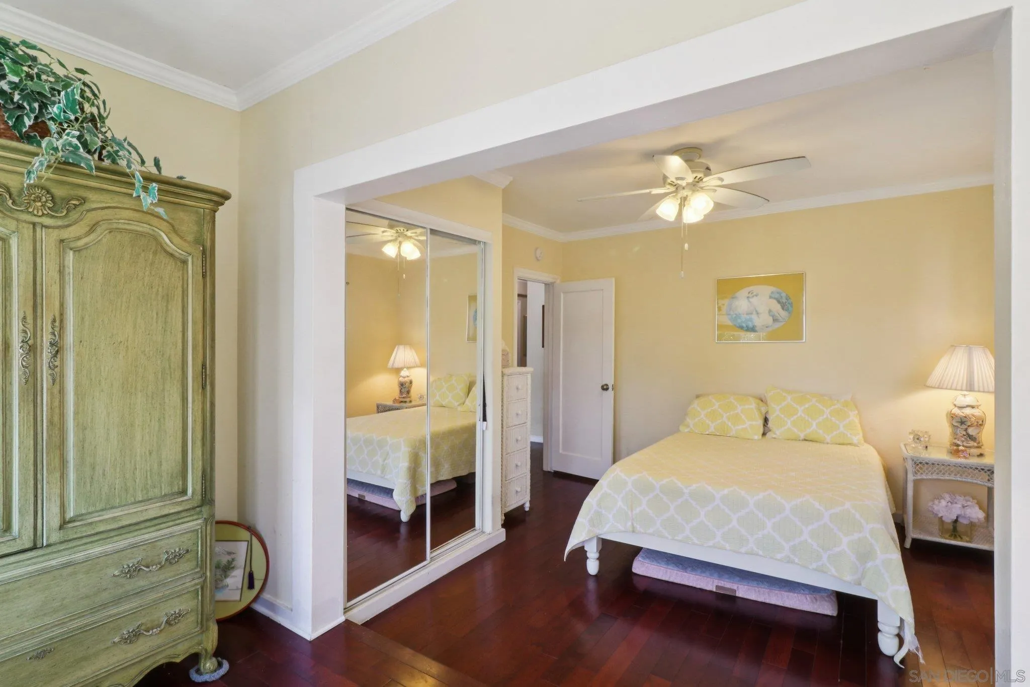 3509-11 32nd Street San Diego, CA 92104 - Photo 22 of 51 a bedroom with a bed and a chandelier