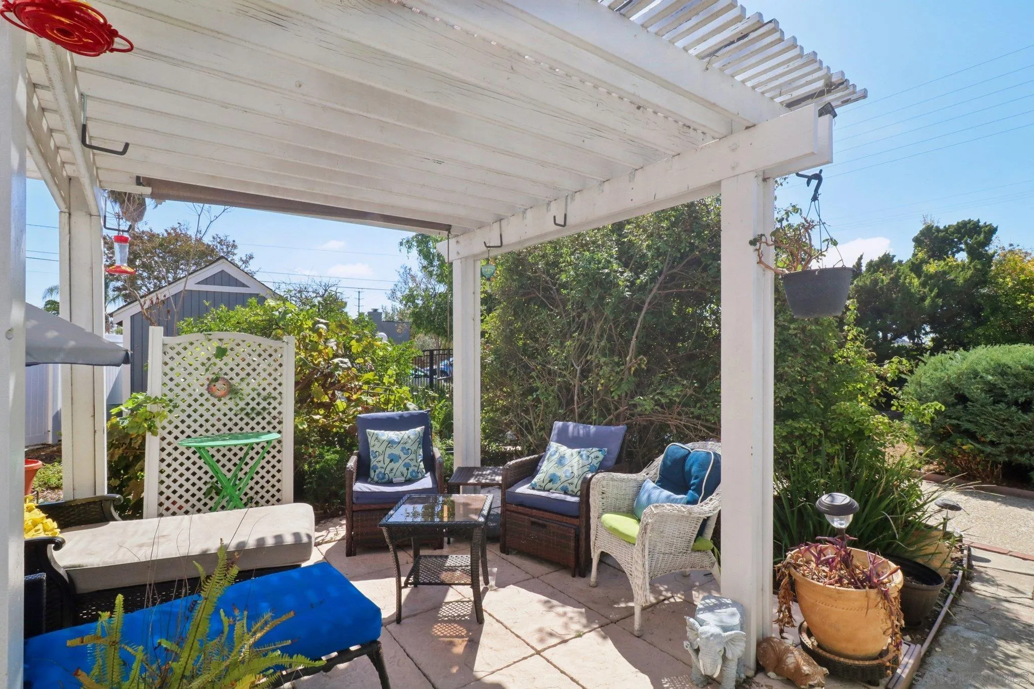 3509-11 32nd Street San Diego, CA 92104 - Photo 25 of 51 a view of a patio with table and chairs potted plants and floor to ceiling window
