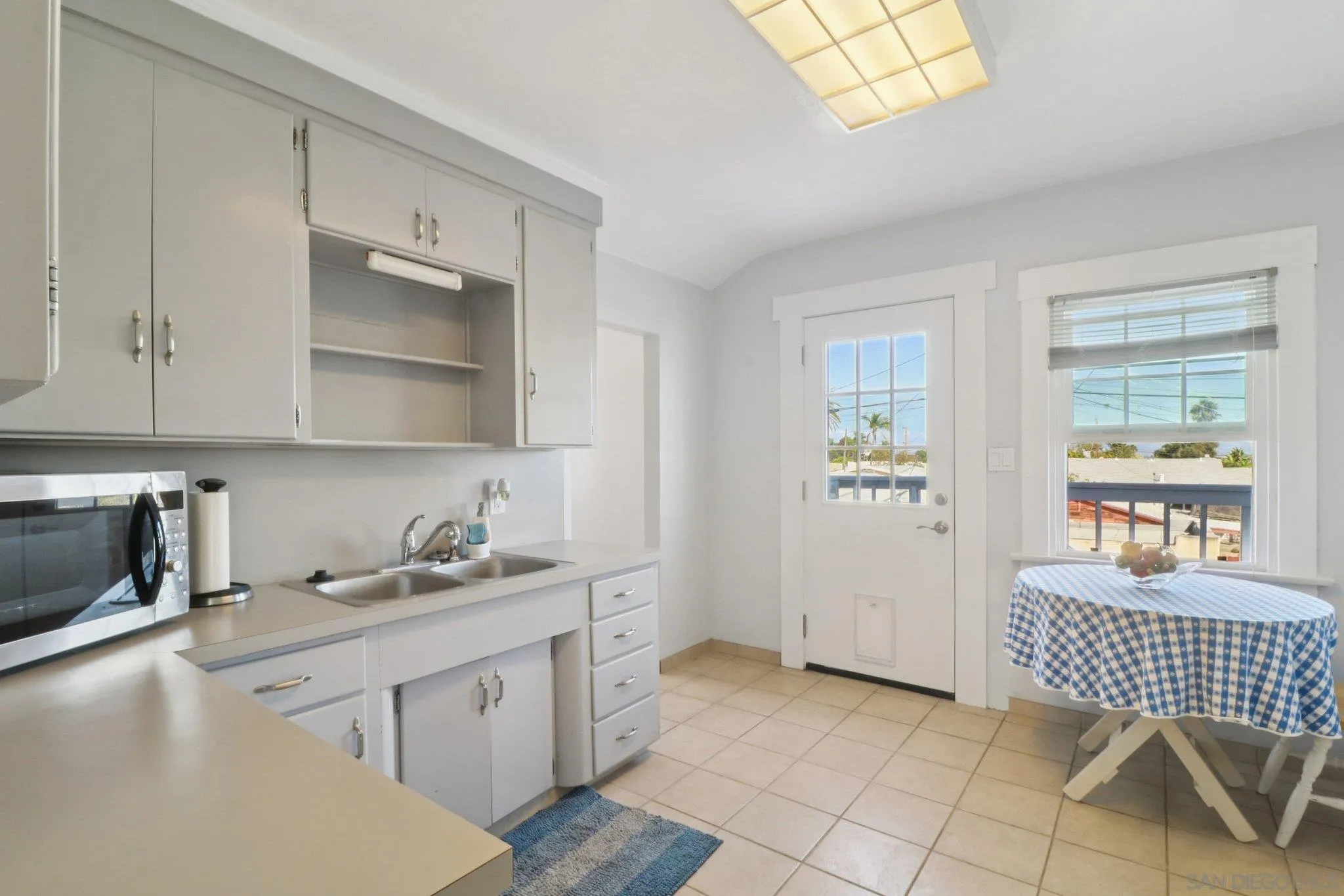 3509-11 32nd Street San Diego, CA 92104 - Photo 28 of 51 a kitchen with a sink cabinets and window