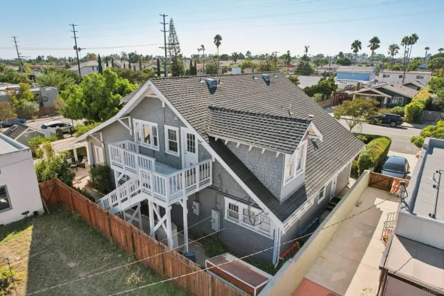 a view of a house with wooden deck