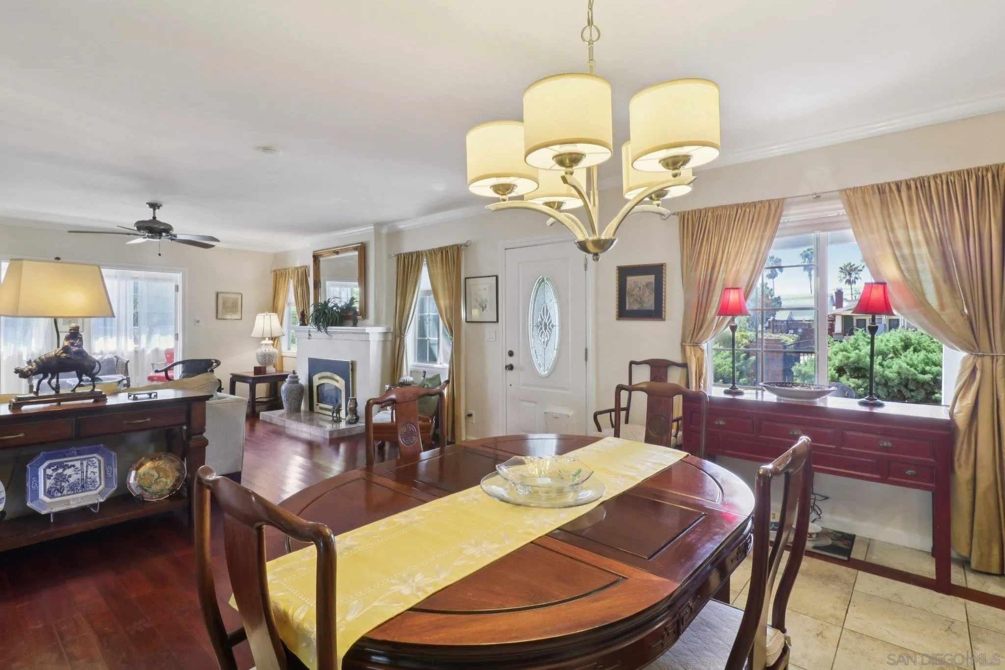 3509-11 32nd Street San Diego, CA 92104 - Photo 7 of 51 a view of a dining room with furniture a chandelier and wooden floor