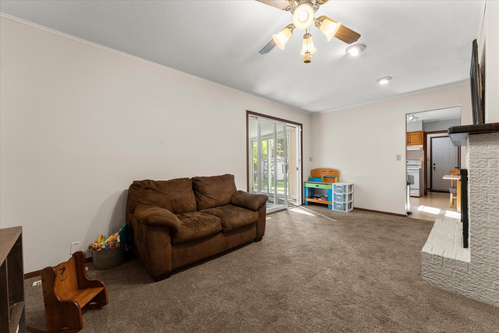1108 Riverside Court Mahomet, IL 61853 - Photo 19 of 50 a living room with furniture and a chandelier
