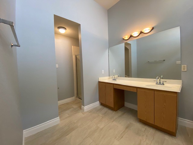 1512 Lorson Loop Round Rock, TX 78665 - Photo 23 of 29 a bathroom with a double vanity sink and a mirror