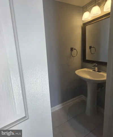 a kitchen with a refrigerator stove and cabinets