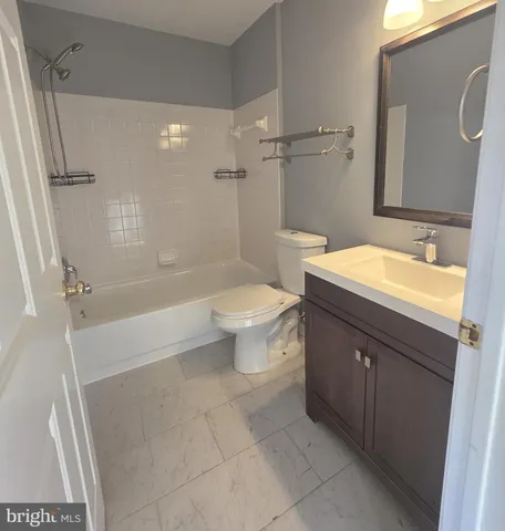 a bathroom with a sink a toilet and a bathtub