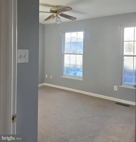 a kitchen with a sink and a mirror