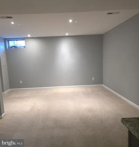 an empty room with closet area