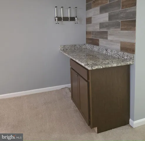 a view of balcony with wooden floor