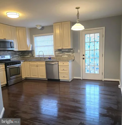 a white toilet sitting next to a shower and sink