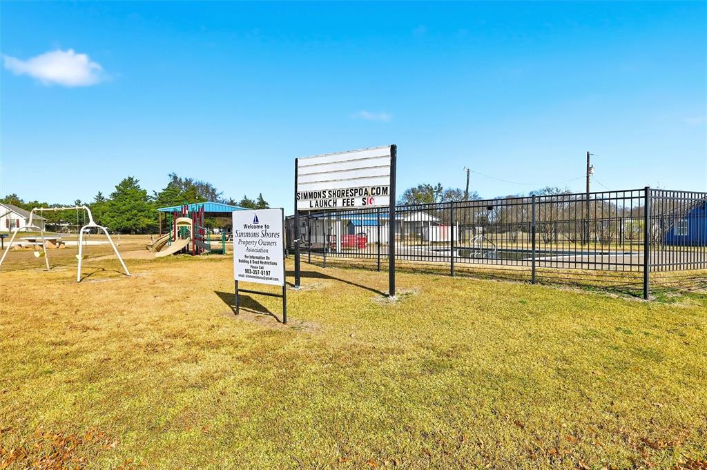 81937 Highway 289 Pottsboro, TX 75076 - Photo 27 of 33 a view of a swimming pool with an outdoor seating and a yard