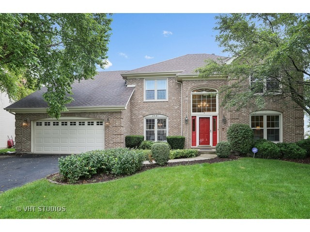 2481 Rio Grande Circle Naperville, IL 60565 - Photo 1 of 25 a front view of house with yard and green space
