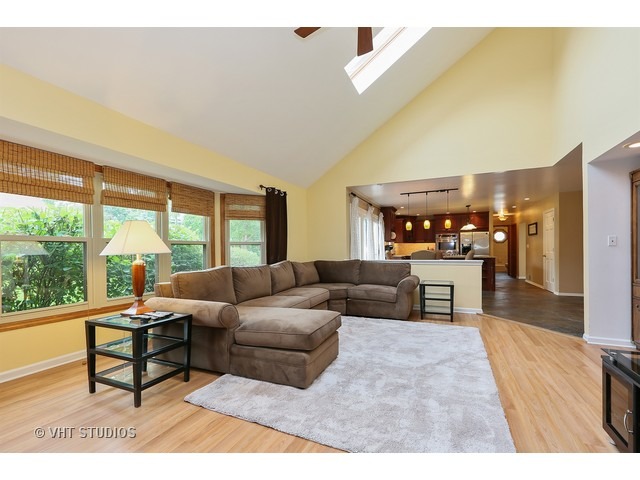 2481 Rio Grande Circle Naperville, IL 60565 - Photo 11 of 25 a living room with furniture and a large window