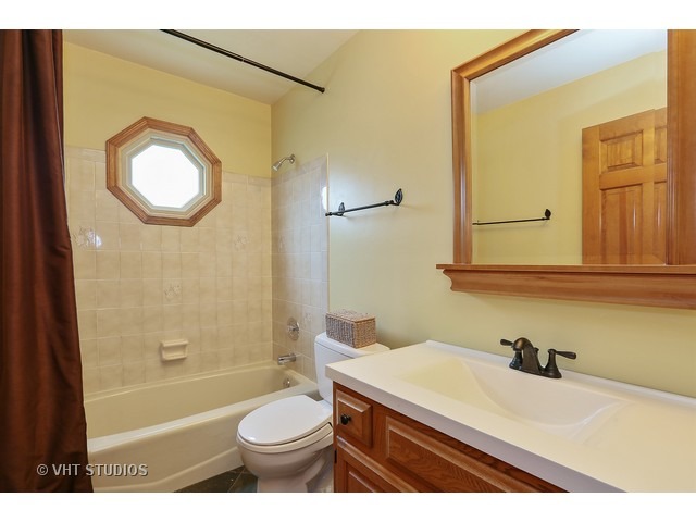 2481 Rio Grande Circle Naperville, IL 60565 - Photo 12 of 25 a bathroom with a sink a toilet and a mirror