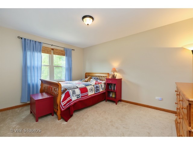 2481 Rio Grande Circle Naperville, IL 60565 - Photo 17 of 25 a bedroom with bed and window