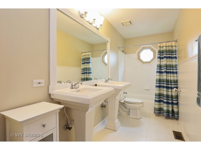 2481 Rio Grande Circle Naperville, IL 60565 - Photo 19 of 25 a bathroom with a sink mirror vanity and toilet