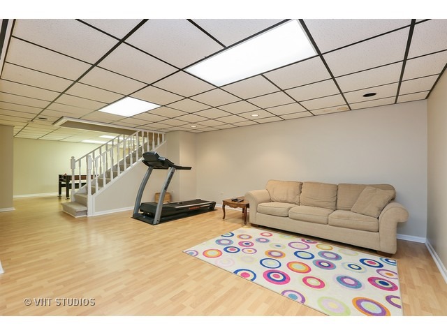 2481 Rio Grande Circle Naperville, IL 60565 - Photo 22 of 25 a living room with furniture and a flat screen tv