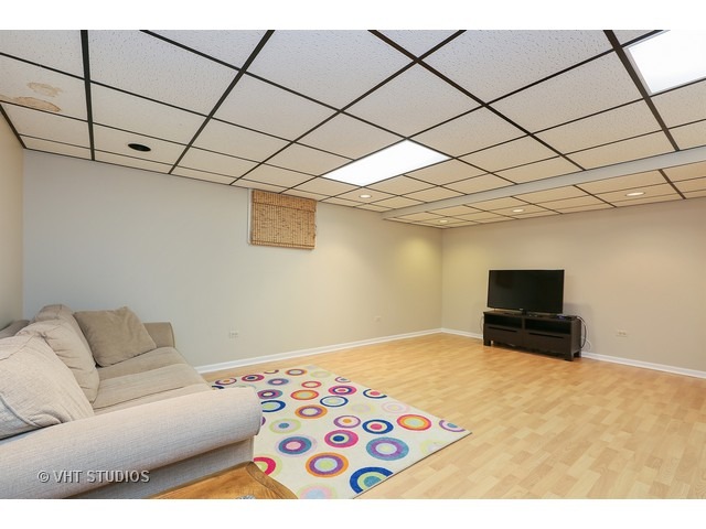 2481 Rio Grande Circle Naperville, IL 60565 - Photo 23 of 25 a bedroom with a bed and a couch