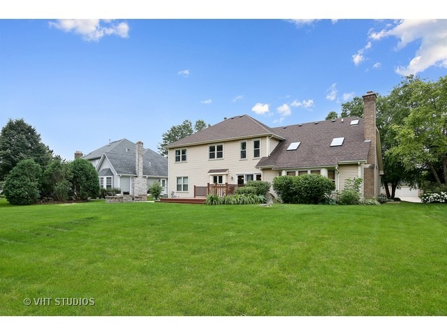 2481 Rio Grande Circle Naperville, IL 60565 - Photo 25 of 25 a view of a big house with a big yard and large trees