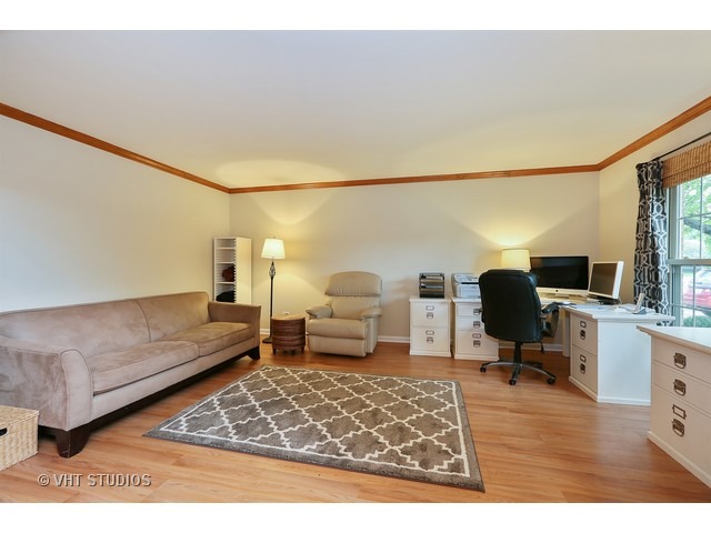2481 Rio Grande Circle Naperville, IL 60565 - Photo 3 of 25 a living room with furniture and a flat screen tv