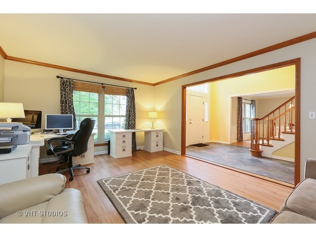 2481 Rio Grande Circle Naperville, IL 60565 - Photo 4 of 25 a living room with furniture rug and a table